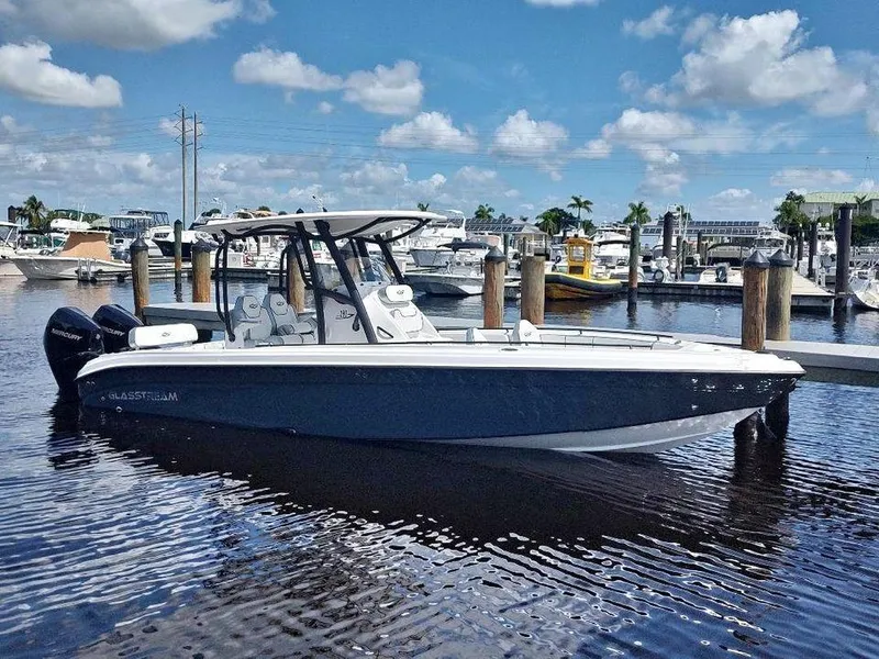 The Image of 2024 Glasstream 280 Pro-XS boat docked in a marina under a blue sky. - 1