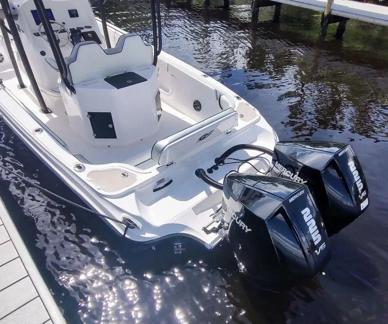 Slide: The Image of 2024 Glasstream 280 Pro-XS boat with dual Mercury outboard engines docked on water. - 7