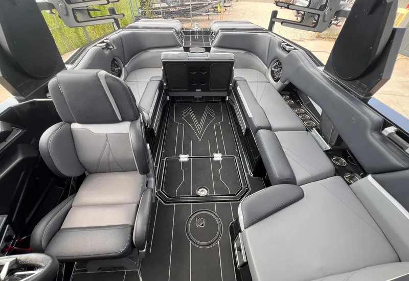 Slide: The Image of 2023 Supra SL 450 boat interior with luxurious seating and modern design. - 17