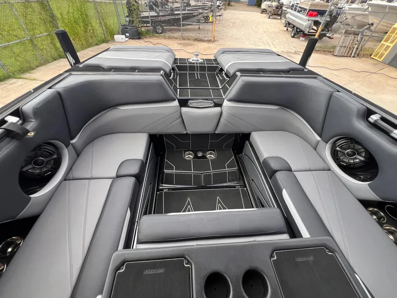 Slide: The Image of 2023 Supra SL 450 boat interior with sleek gray seating and modern design. - 19