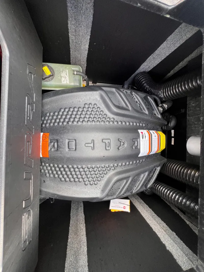 Slide: The Image of 2023 Supra SL 450 engine compartment with detailed components and branding. - 20