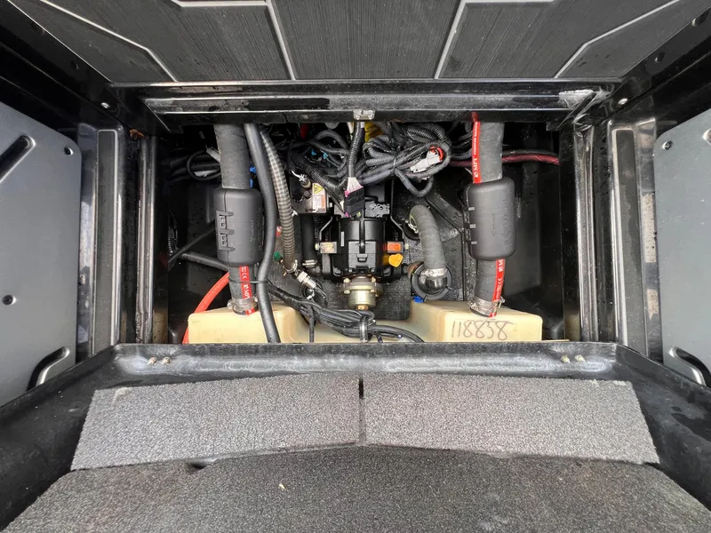 Slide: The Image of 2023 Supra SL 450 engine compartment with visible wiring and components. - 21