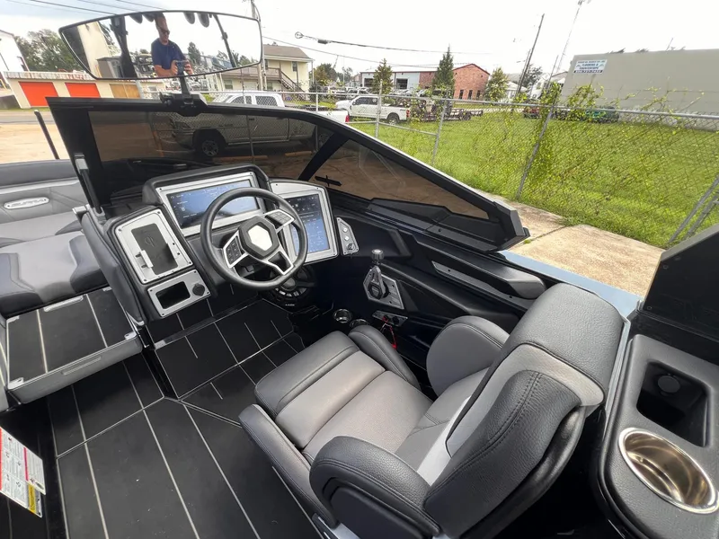Slide: The Image of 2023 Supra SL 450 boat interior with modern dashboard and comfortable seating. - 4