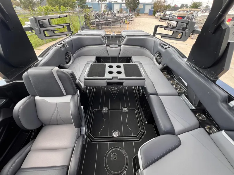 Slide: The Image of 2023 Supra SL 450 boat interior with luxurious seating and cup holders. - 5