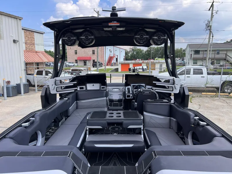 Slide: The Image of 2023 Supra SL 450 boat interior with modern seating and audio system. - 7