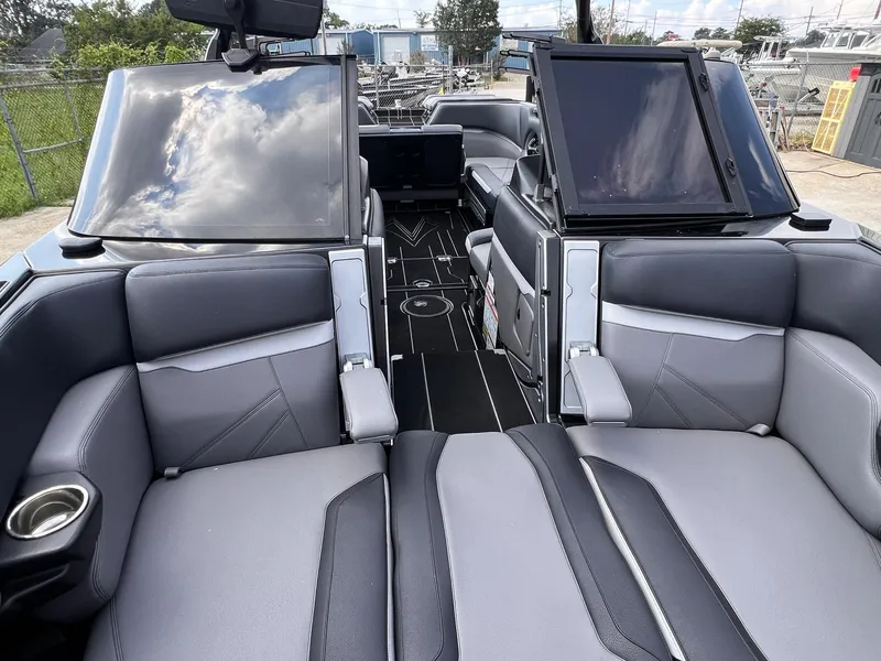 Slide: The Image of 2023 Supra SL 450 boat interior with sleek gray seating and modern design. - 8