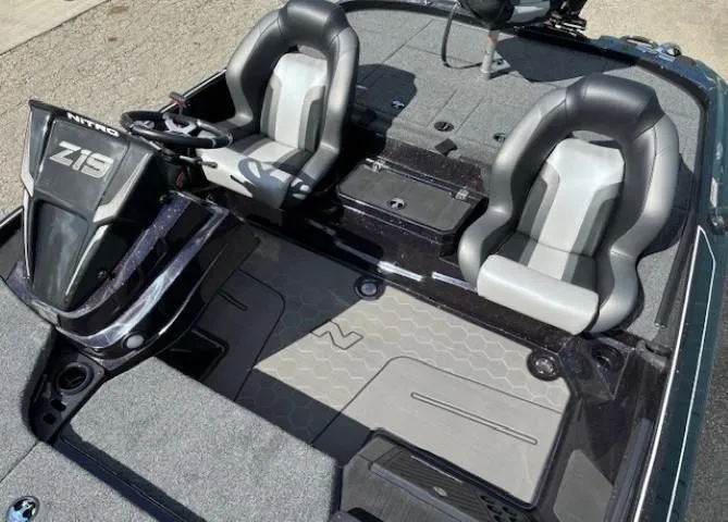 Slide: The Image of 2025 Nitro Z19 Pro boat interior with dual seats and steering console. - 13