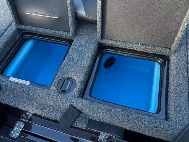 Slide: The Image of 2025 Nitro Z19 Pro boat storage compartments with blue interior. - 15
