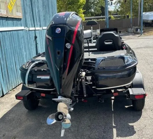 Slide: The Image of 2025 Nitro Z19 Pro boat with powerful outboard motor, parked on a trailer. - 3
