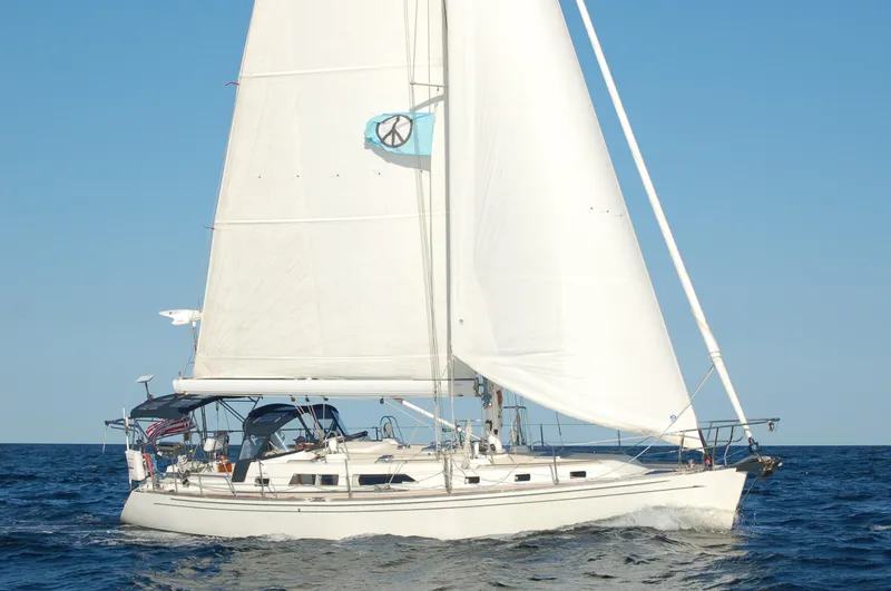 The Image of Sailing yacht Outbound 46, 2007 model, cruising on open sea under clear blue sky. - 0