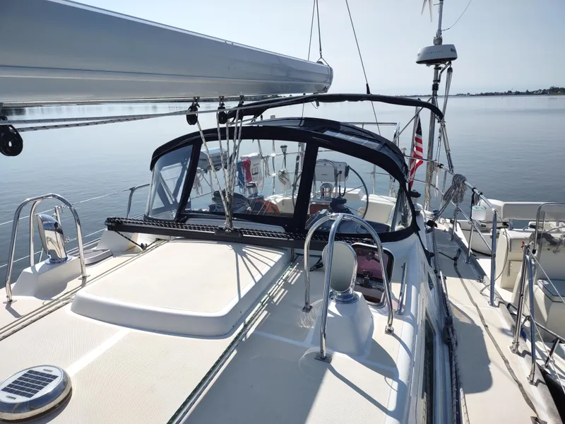 Slide: The Image of Sailing yacht Outbound 46, 2007 model, with sleek deck and cockpit, on calm waters. - 14