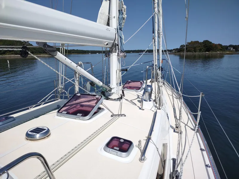 Slide: The Image of Sailboat deck view of 2007 Outbound 46 on calm water. - 15
