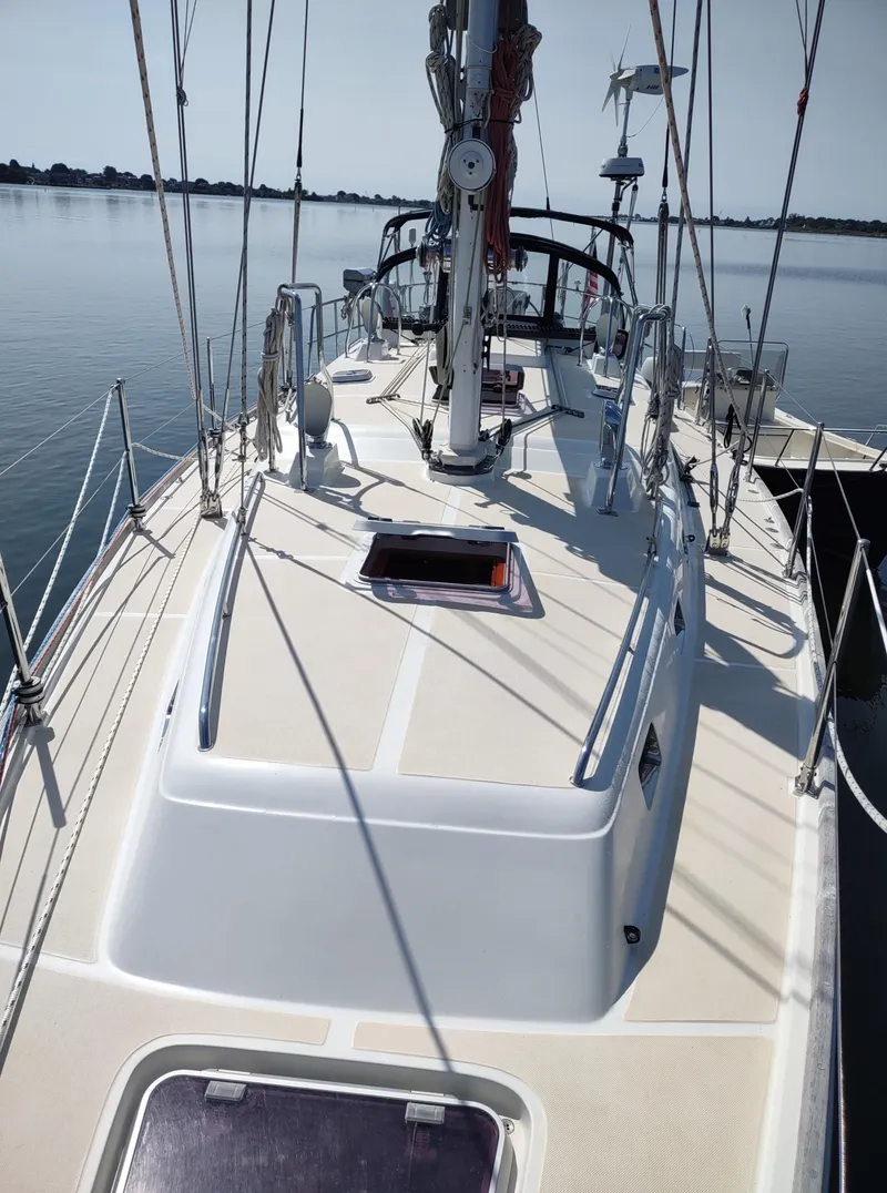 Slide: The Image of Outbound 46 sailboat deck, 2007 model, docked on calm water under clear skies. - 17