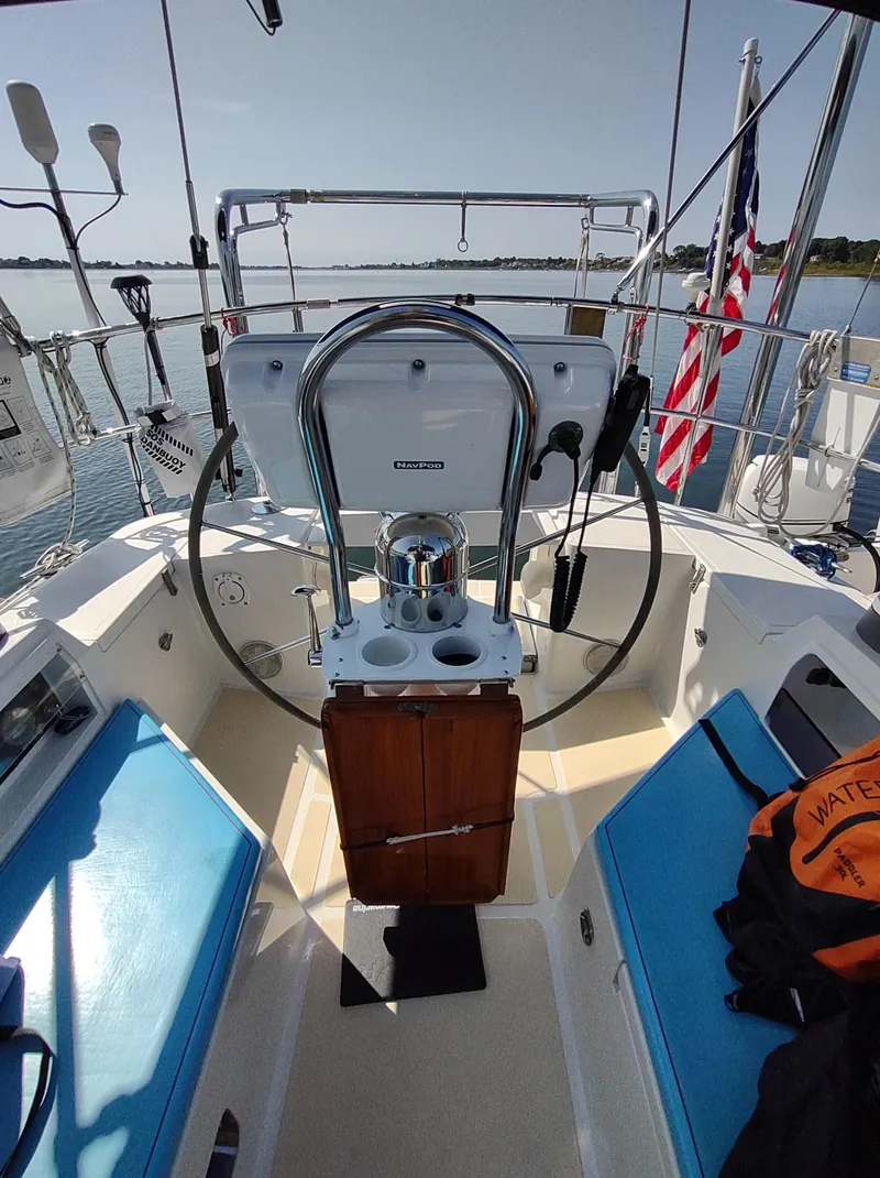 Slide: The Image of Cockpit of 2007 Outbound 46 sailboat with steering wheel and seating. - 20
