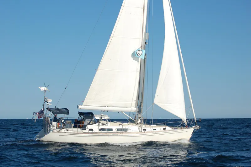 Slide: The Image of Sailing yacht Outbound 46, 2007 model, cruising on open sea under clear blue sky. - 3