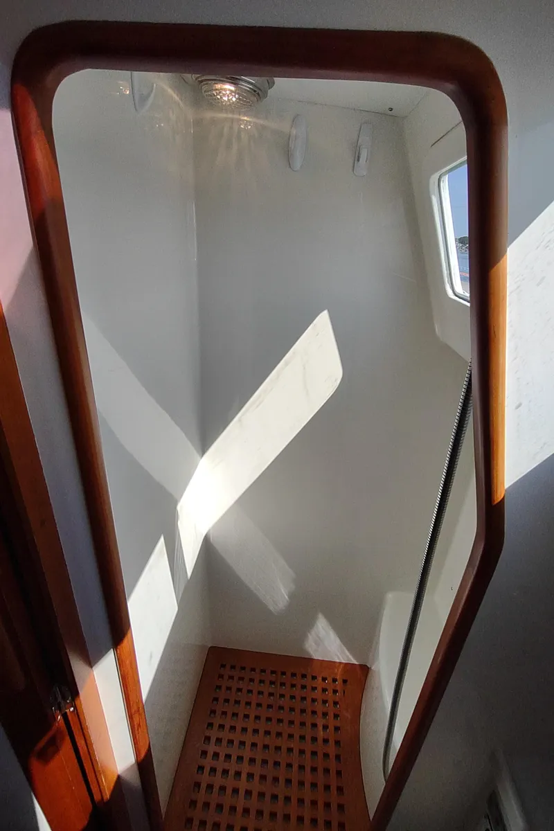 Slide: The Image of Interior of 2007 Outbound 46 sailboat with wooden trim and natural light. - 39