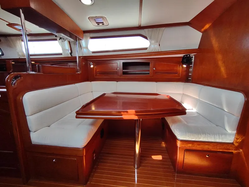 Slide: The Image of Luxurious interior of 2007 Outbound 46 yacht with elegant wood finish and plush seating. - 44