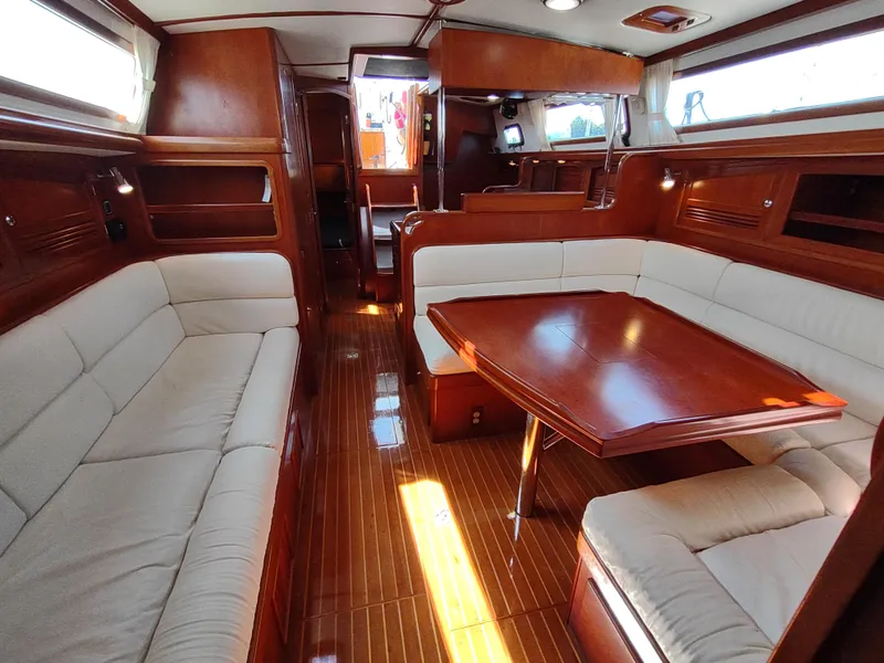 Slide: The Image of Luxurious interior of 2007 Outbound 46 yacht with elegant wood finish and plush seating. - 46