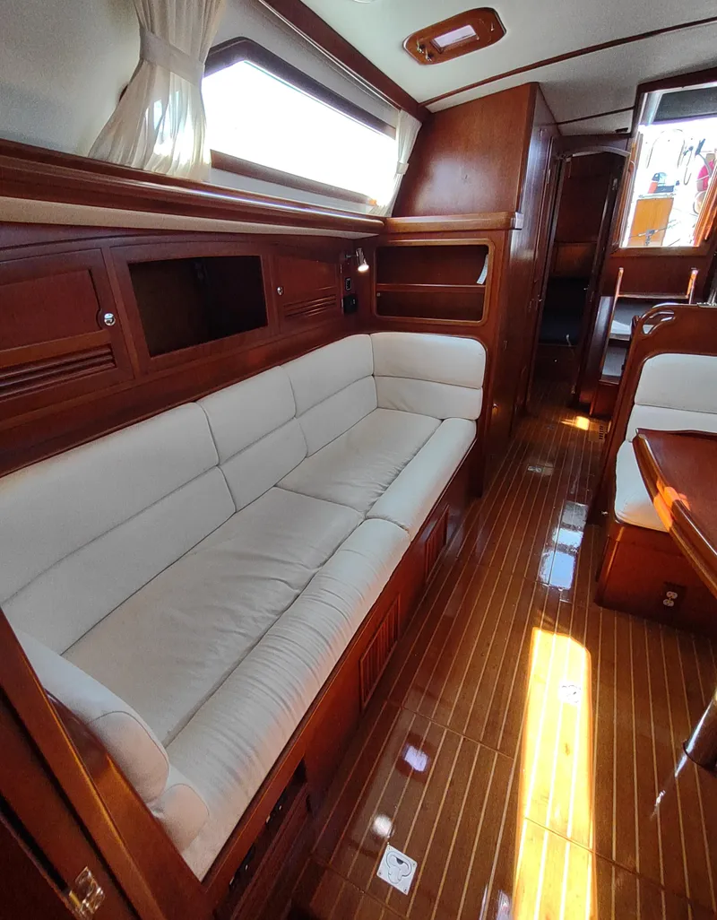 Slide: The Image of Luxurious 2007 Outbound 46 yacht interior with elegant wood finish and comfortable seating. - 47