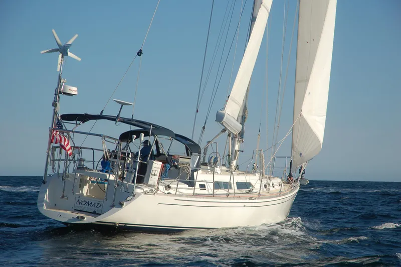 Slide: The Image of Sailing yacht Outbound 46, 2007 model, cruising on open sea with full sails. - 8