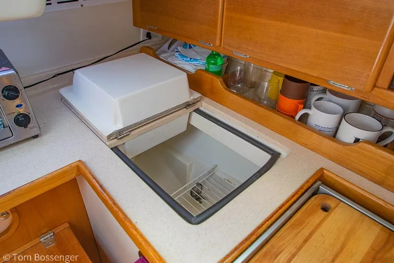 Slide: The Image of Interior of 2002 Catalina 36 MkII yacht showing kitchen counter and storage. - 12