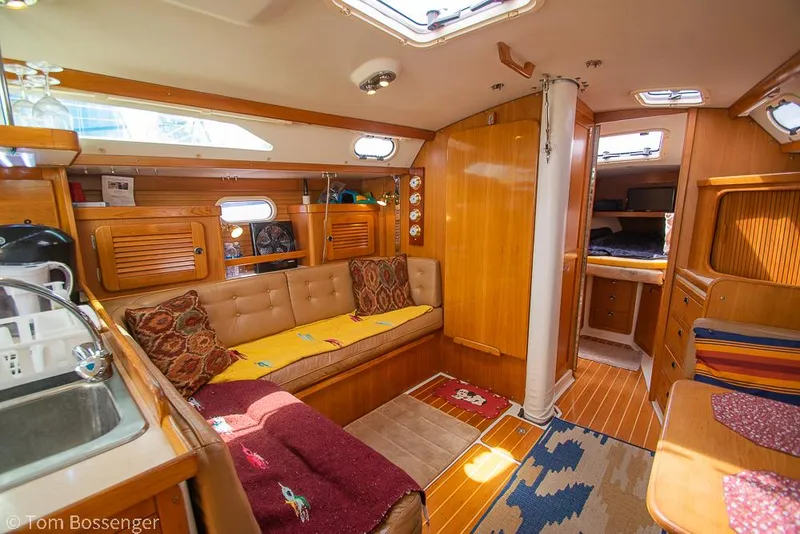 Slide: The Image of Interior of 2002 Catalina 36 MkII sailboat with cozy seating and wooden finishes. - 14
