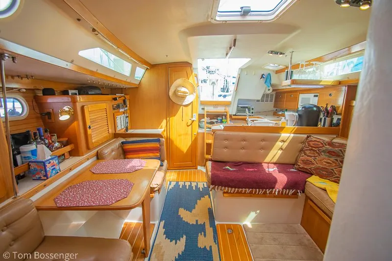 Slide: The Image of Interior of 2002 Catalina 36 MkII sailboat with cozy seating and dining area. - 26