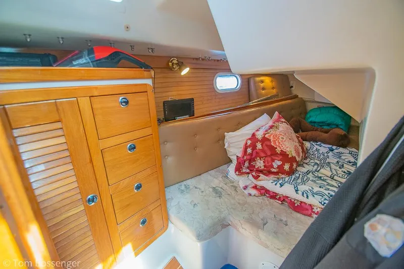 Slide: The Image of Cozy cabin interior of 2002 Catalina 36 MkII sailboat with wooden cabinetry and bedding. - 29
