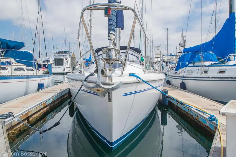 Slide: The Image of 2002 Catalina 36 MkII sailboat docked in a marina, surrounded by other boats. - 3