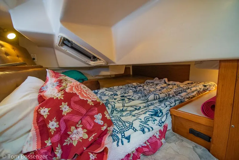 Slide: The Image of Cozy cabin interior of a 2002 Catalina 36 MkII sailboat with colorful bedding. - 30