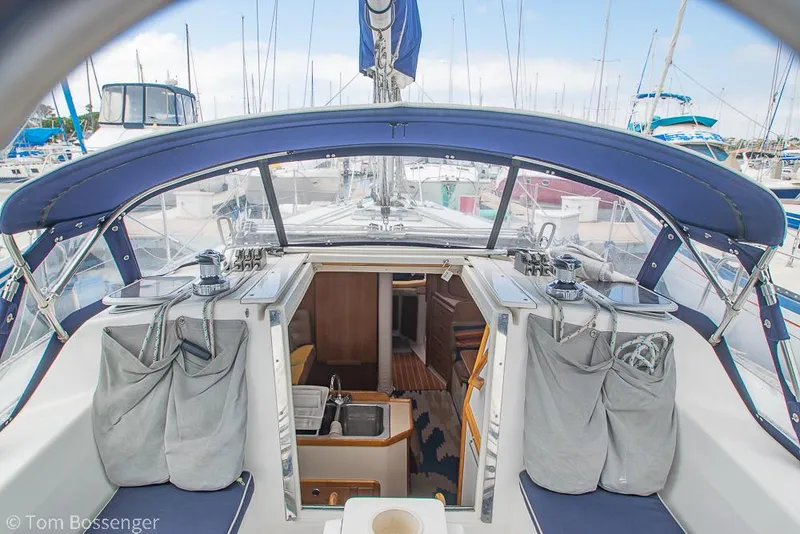 Slide: The Image of 2002 Catalina 36 MkII sailboat cockpit with blue canopy and marina view. - 35