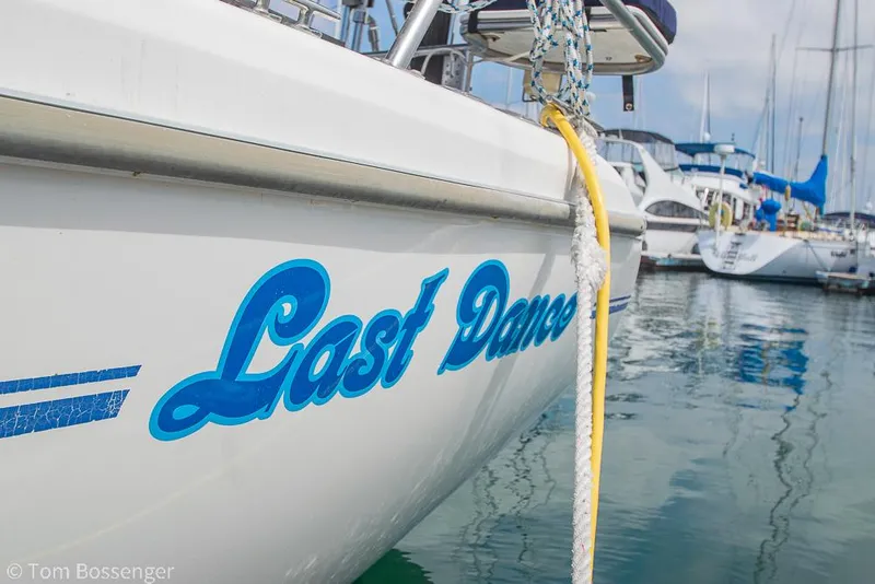 Slide: The Image of Catalina 36 MkII sailboat named "Last Dance" docked in a marina, 2002 model. - 4
