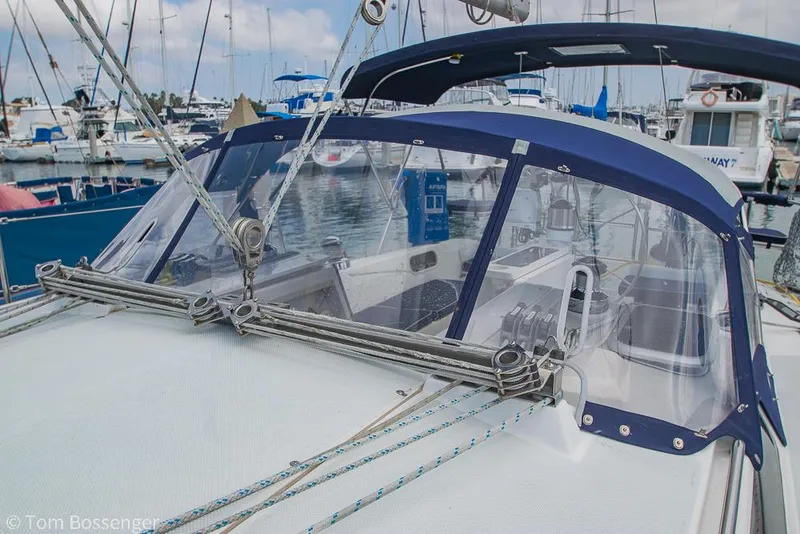 Slide: The Image of 2002 Catalina 36 MkII sailboat with blue canopy and clear windscreen in marina. - 44