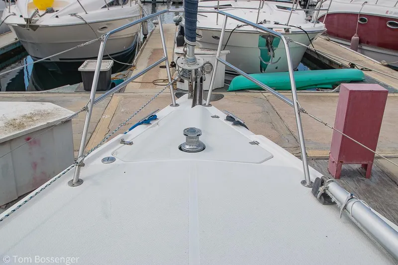 Slide: The Image of Bow view of a 2002 Catalina 36 MkII sailboat docked at a marina. - 47