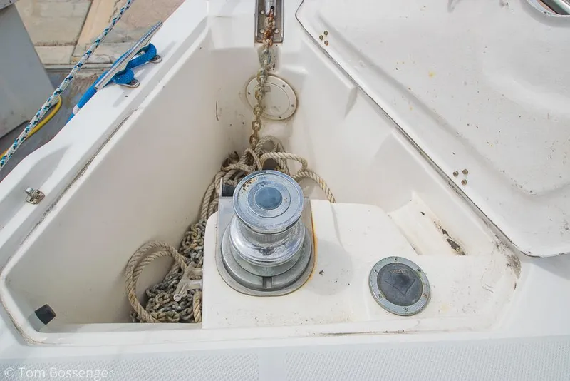 Slide: The Image of Anchor locker of a 2002 Catalina 36 MkII sailboat with ropes and chains. - 49