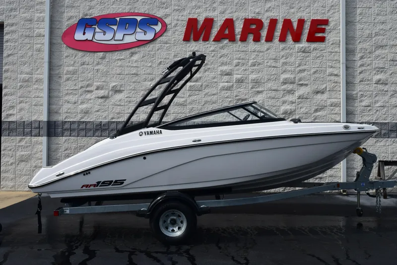 The Image of 2025 Yamaha AR195 boat on trailer at GSPS Marine dealership. - 1