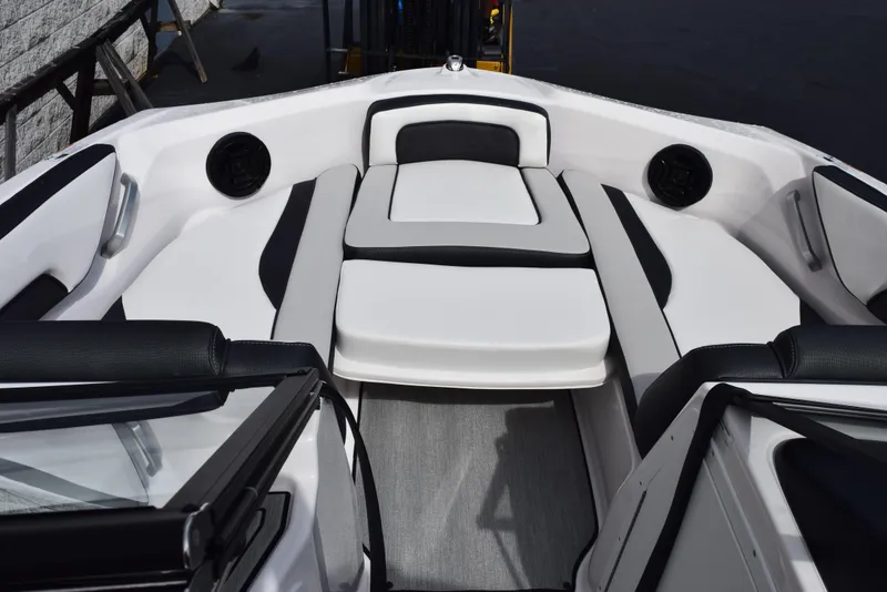 Slide: The Image of 2025 Yamaha Boats AR195 interior with sleek white and black seating design. - 11