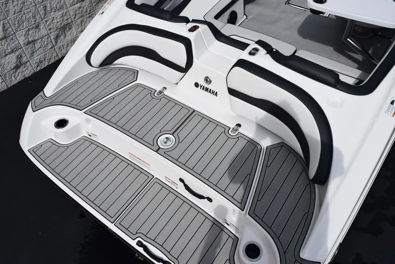 Slide: The Image of 2025 Yamaha Boats AR195 swim platform with sleek design and comfortable seating. - 7
