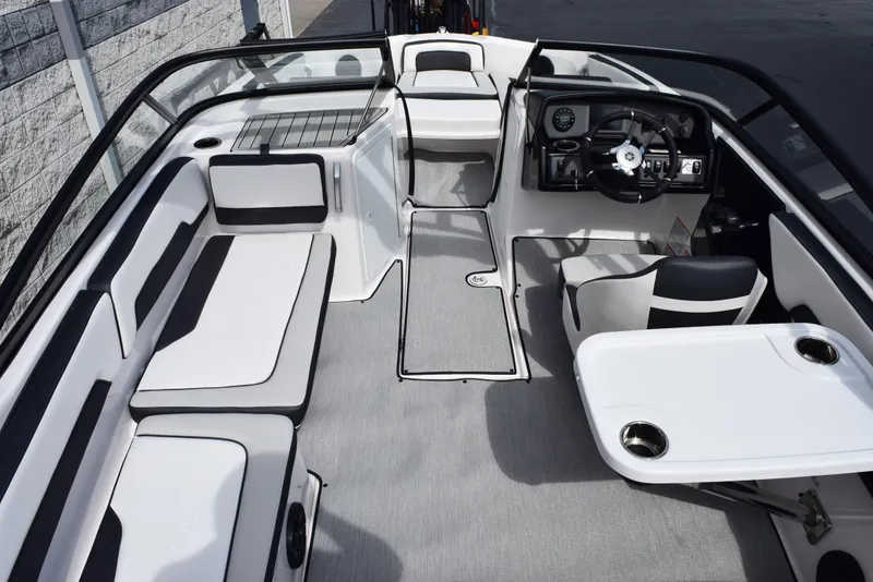 Slide: The Image of 2025 Yamaha Boats AR195 interior with sleek seating and modern dashboard design. - 8