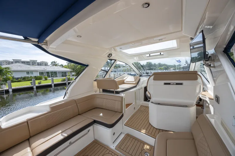 Slide: The Image of 2019 Sea Ray Sundancer 350 Coupe interior with spacious seating and elegant design. - 28