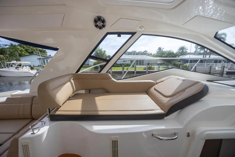 Slide: The Image of 2019 Sea Ray Sundancer 350 Coupe interior with luxurious seating and scenic view. - 31