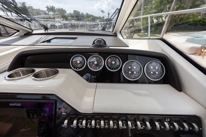 Slide: The Image of 2019 Sea Ray Sundancer 350 Coupe dashboard with gauges and controls. - 34