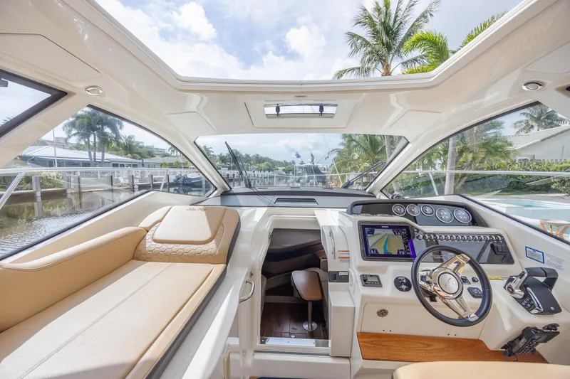 Slide: The Image of 2019 Sea Ray Sundancer 350 Coupe interior with luxurious seating and modern navigation system. - 38