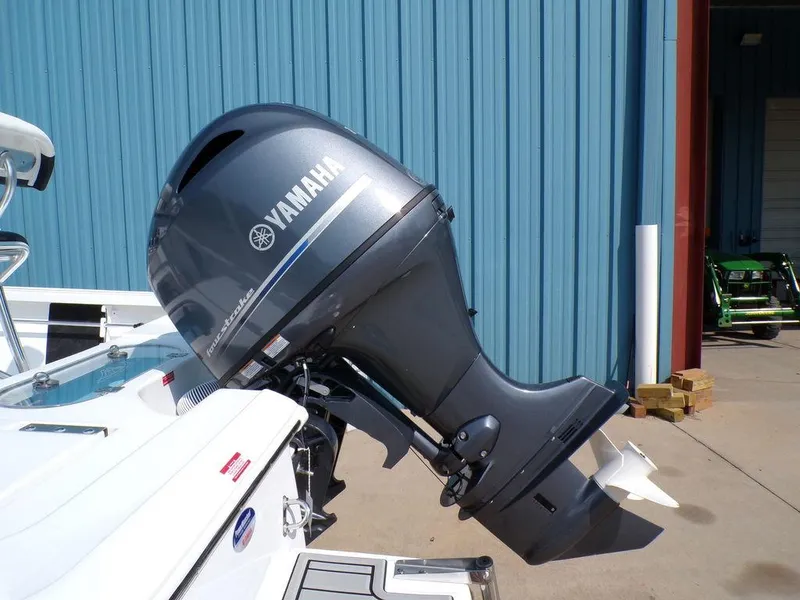 Slide: The Image of Yamaha outboard motor on 2025 Tidewater 1910 Bay Max boat, docked near blue building. - 15