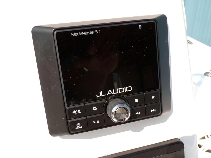 Slide: The Image of JL Audio MediaMaster 50 control panel on 2025 Tidewater 1910 Bay Max boat. - 17
