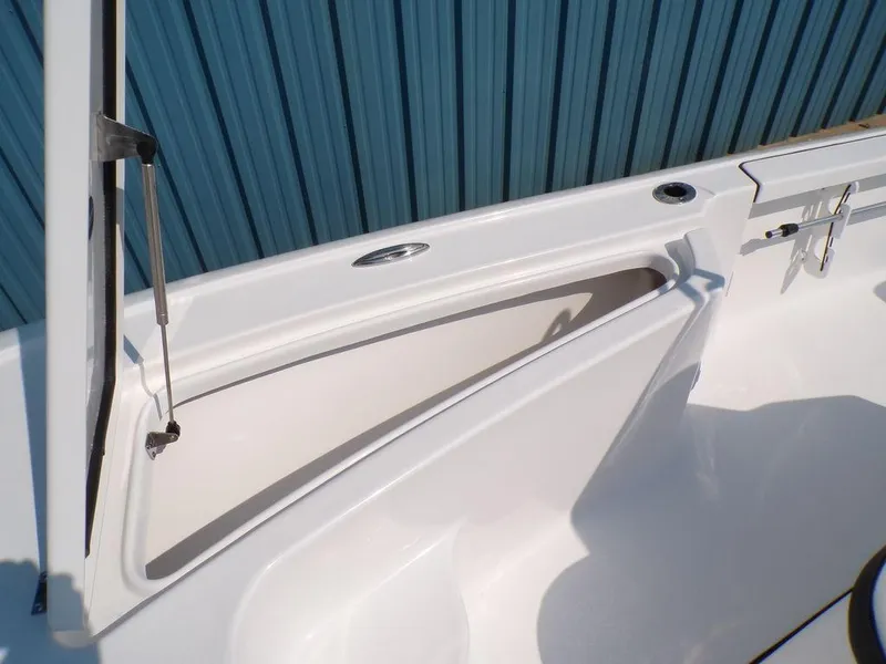 Slide: The Image of 2025 Tidewater 1910 Bay Max boat storage compartment with sleek design and blue backdrop. - 3