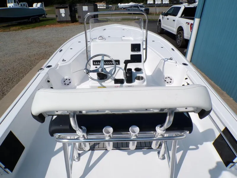Slide: The Image of 2025 Tidewater 1910 Bay Max boat interior with steering console and seating. - 7
