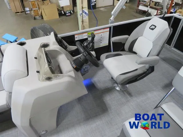 Slide: The Image of 2025 Princecraft Vectra 23 RL pontoon boat interior with steering console and captain's chair. - 14
