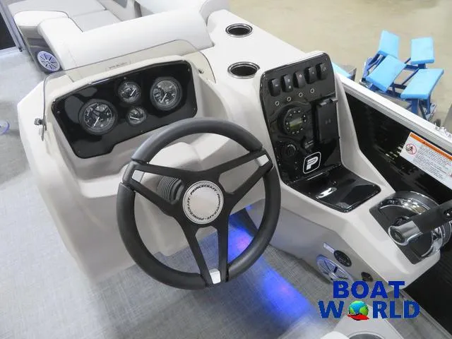 Slide: The Image of 2025 Princecraft Vectra 23 RL pontoon boat dashboard with steering wheel and controls. - 16