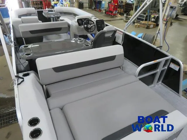 Slide: The Image of 2025 Princecraft Vectra 23 RL pontoon boat interior with seating and steering console. - 23